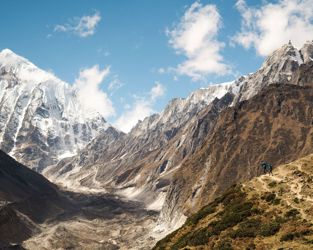 Rocky glacial valley beneath snow-capped peaks in the Everest region