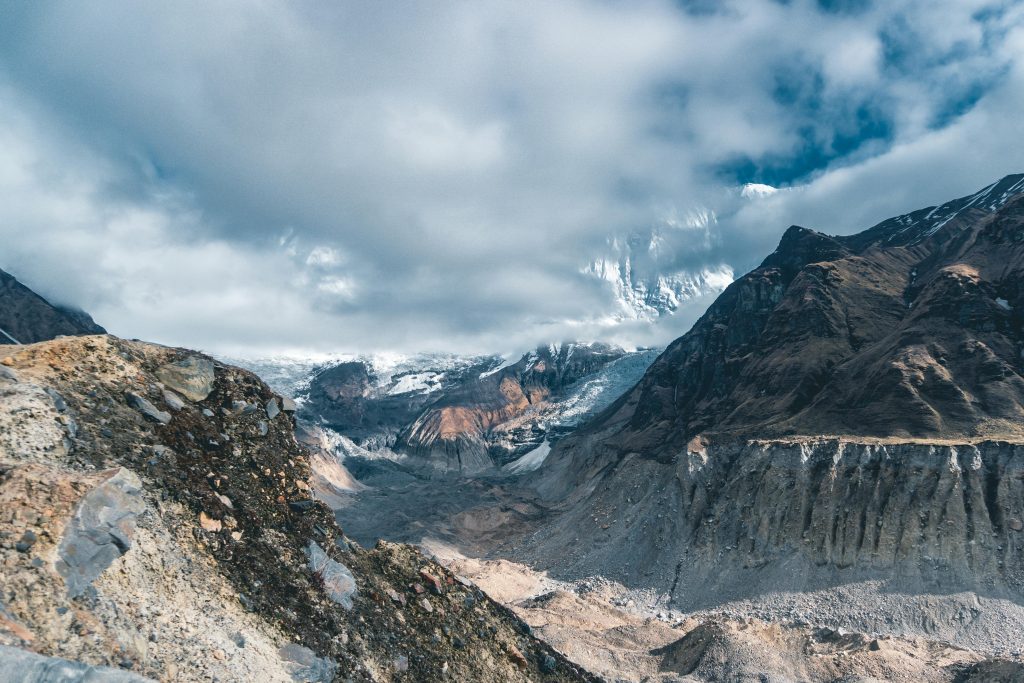 Khumbu Glacier and moraine beneath snowy peaks