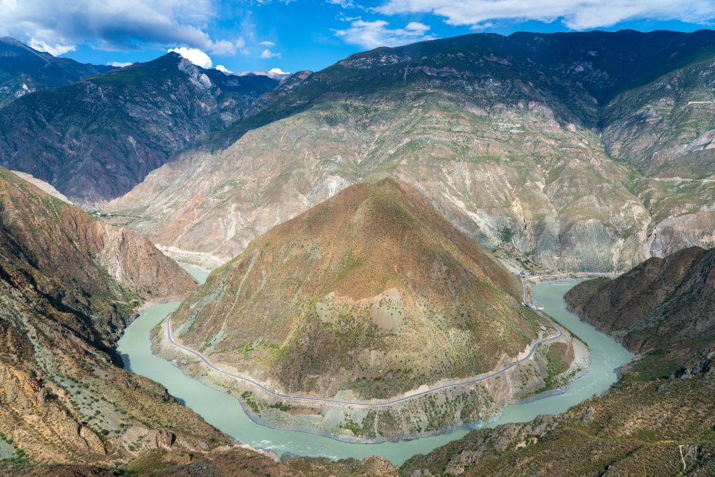 River curving in a horseshoe bend through a deep, steep-sided mountain gorge